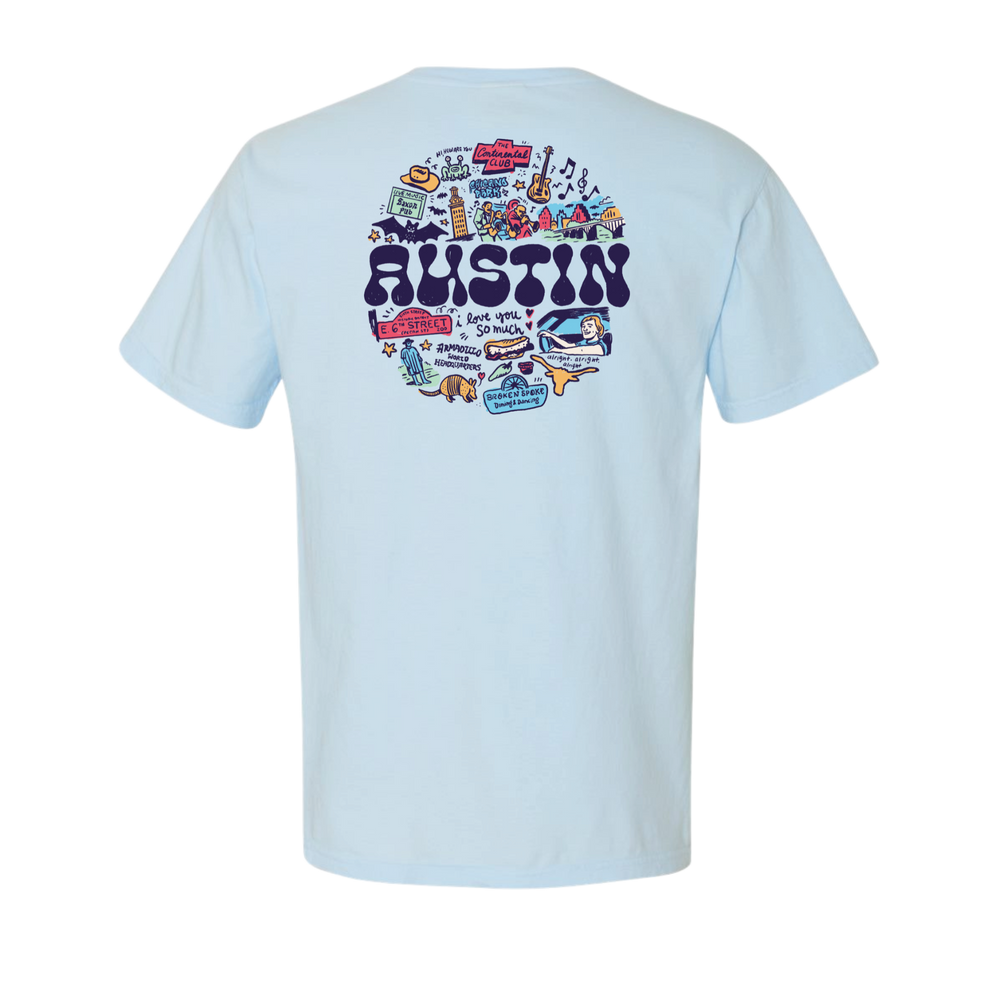 Light blue t-shirt with colorful 'Austin' graphic on the back.