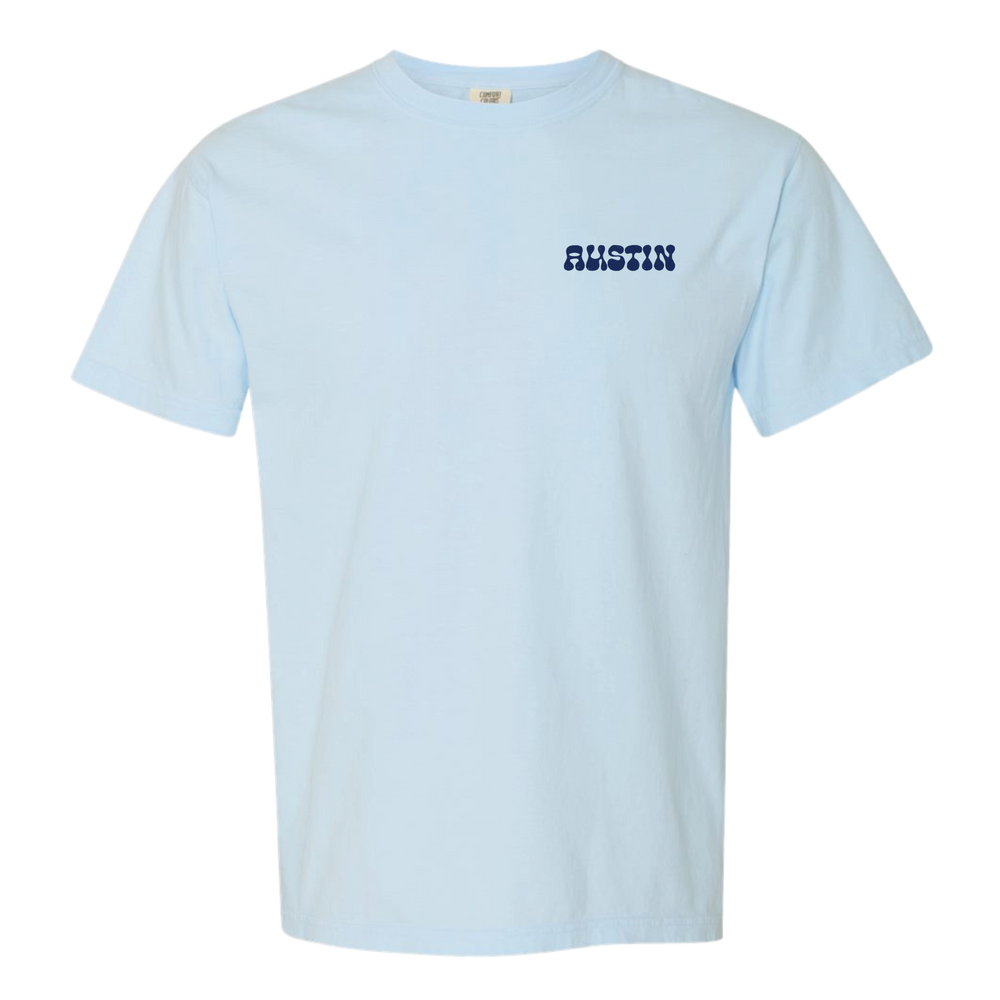 Light blue t-shirt with 'AUSTIN' printed on  pocket