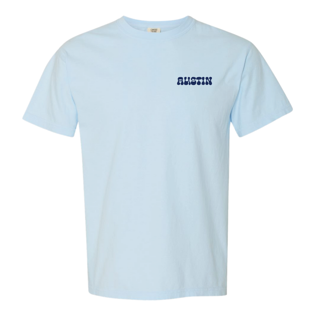 Light blue t-shirt with 'AUSTIN' printed on  pocket