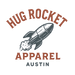 Logo of Hug Rocket Apparel with a rocket graphic on a transparent background